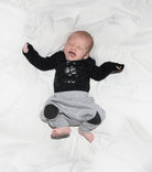 NUNUNU Skull Onesie | Black onesieNUNUNUTAYLOR + MAX
